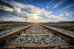 railroad track with vibrant sky